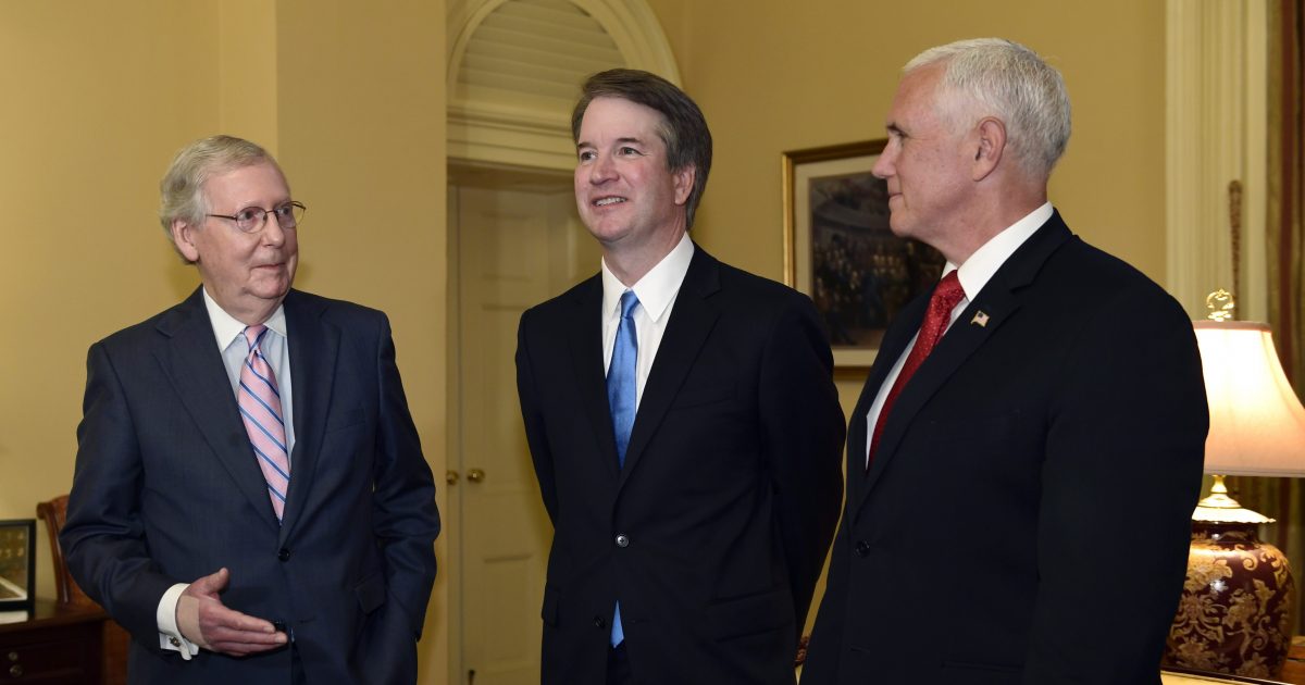 Senate Majority Leader Mitch McConnell of Ky., left, speaks as he talks about Supreme Court nominee Brett Kavanaugh, center, as Vice President Mike Pence, right, listens, during a visit Capitol Hill in Washington.