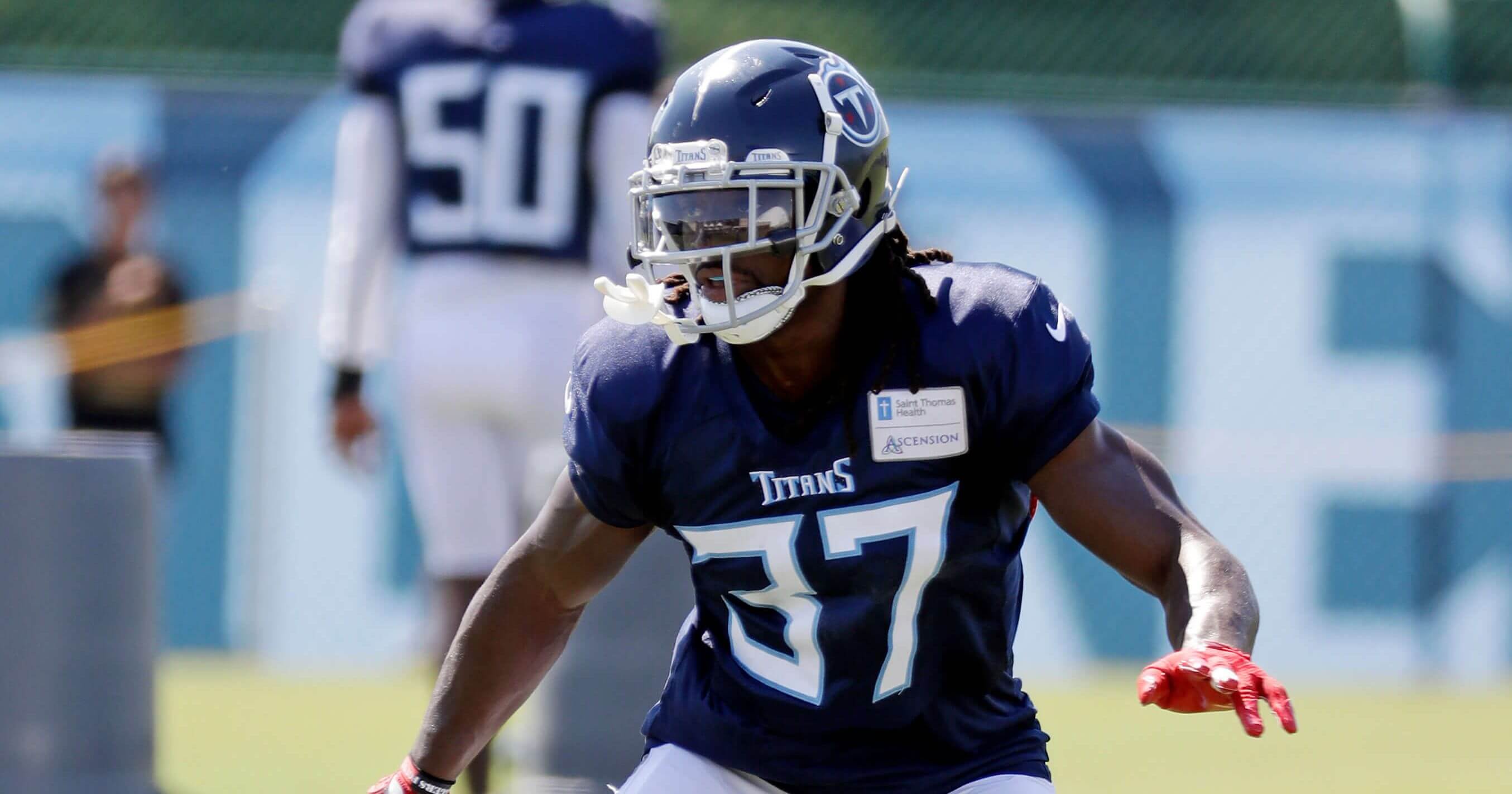 FILE - In this July 29, 2018, file photo, Tennessee Titans defensive back Johnathan Cyprien runs a drill during NFL football training camp in Nashville, Tenn. Cyprien will miss the season with a torn left ACL, and coach Mike Vrabel says veteran Eric Reid is among the safeties the Titans want to look at for a potential replacement. Cyprien left practice Wednesday, Aug. 1, 2018, after grabbing at his left knee.