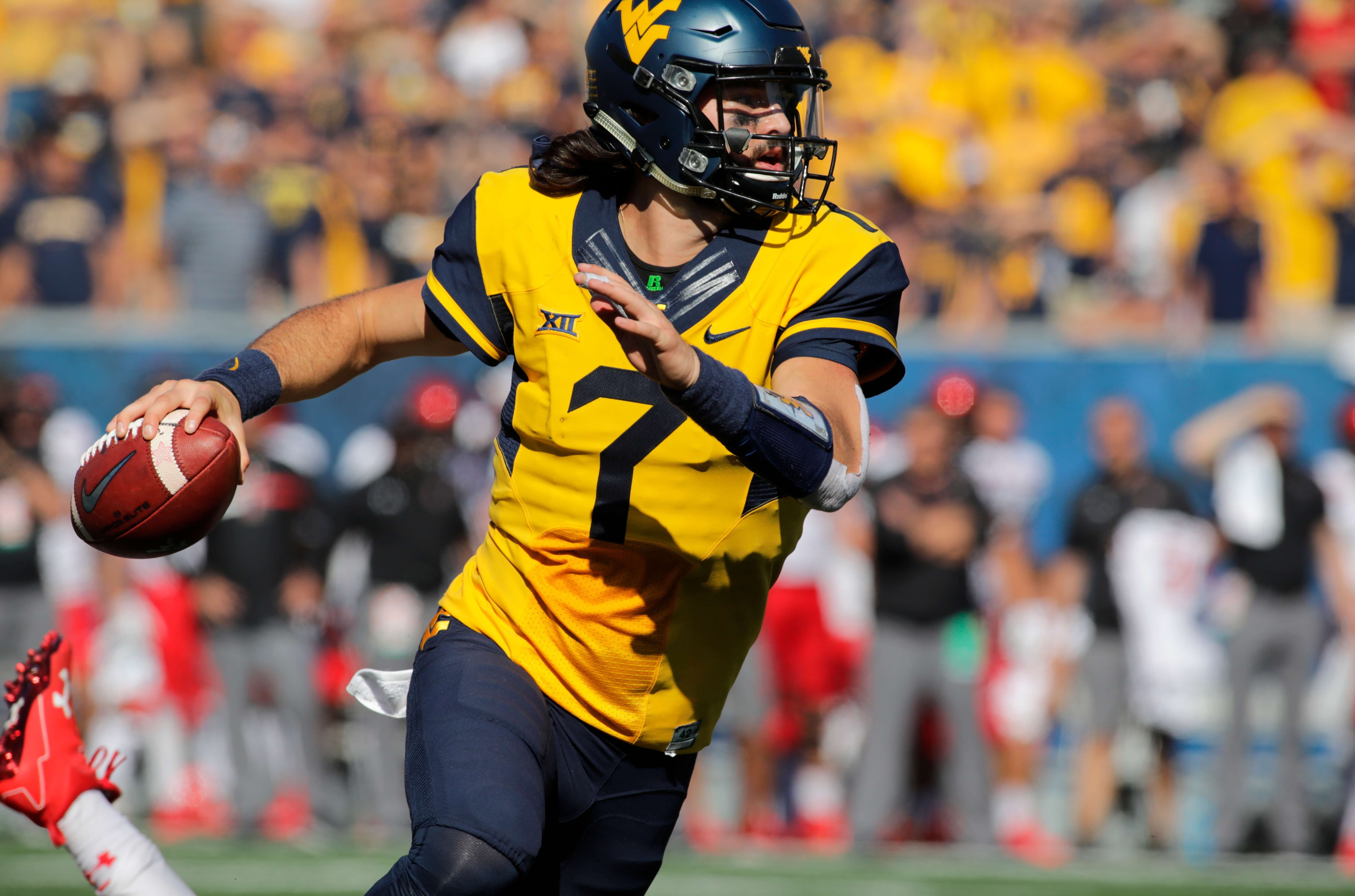 In this Oct. 14, 2017, file photo, West Virginia quarterback Will Grier (7) looks to pass against Texas Tech during an NCAA college football game in Morgantown, W.Va. While the Sooners are still the preseason favorite again, there are also high expectations for Grier, the preseason Big 12 offensive player of the year who threw 34 touchdowns and 3,490 yards in his injury-shortened WVU debut.