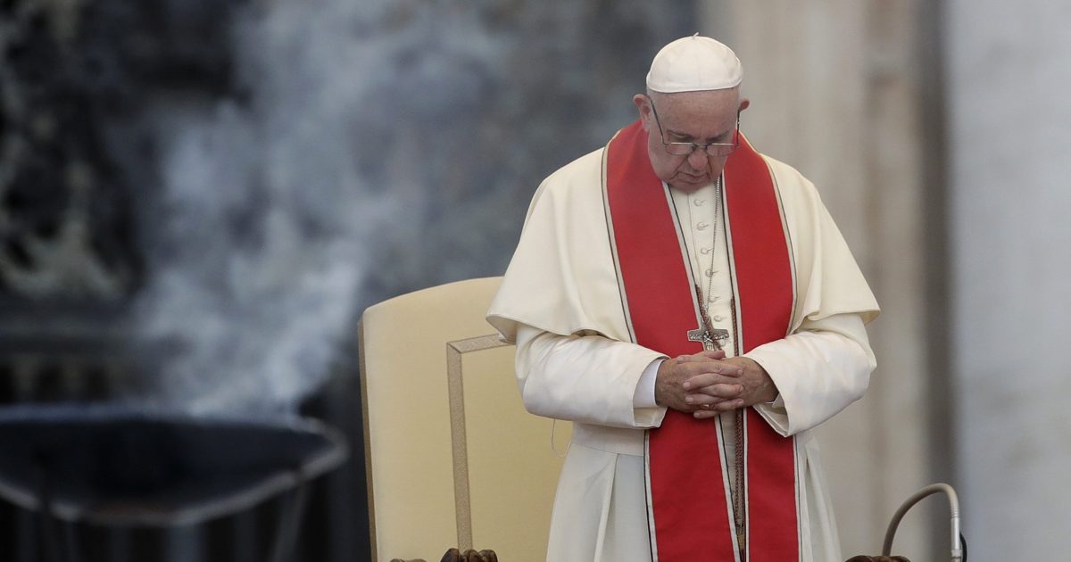 Pope Francis prays during an audience in St. Peter's square at the Vatican.