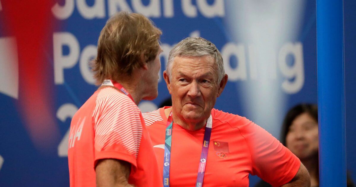 Mark Schubert, left, former USA Swimming's National Team head coach, talks with former Australian swim coach Dennis Cottrell at the 18th Asian Games in Jakarta, Indonesia, Wednesday, Aug. 22, 2018.