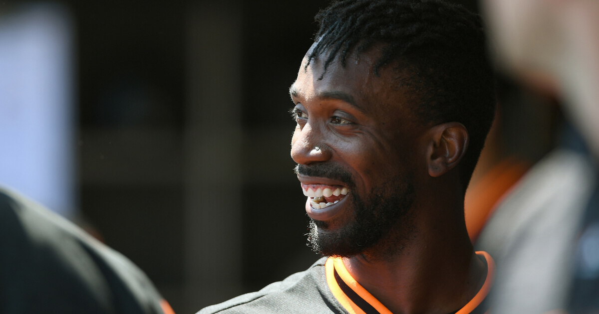 Andrew McCutchen of the San Francisco Giants looks on from the dugout after he scored against the Texas Rangers in the bottom of the first inning at AT&T Park on Aug. 25.