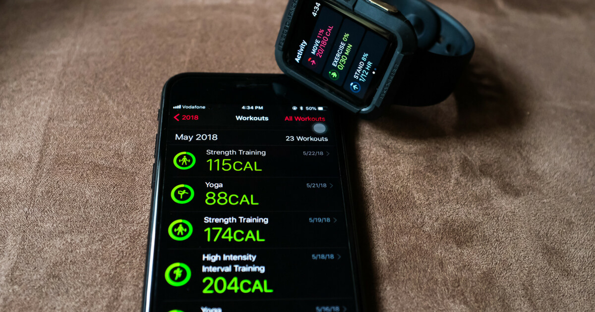 Apple iPhone and Apple Watch showing calories burnt during workouts in the Activity app.
