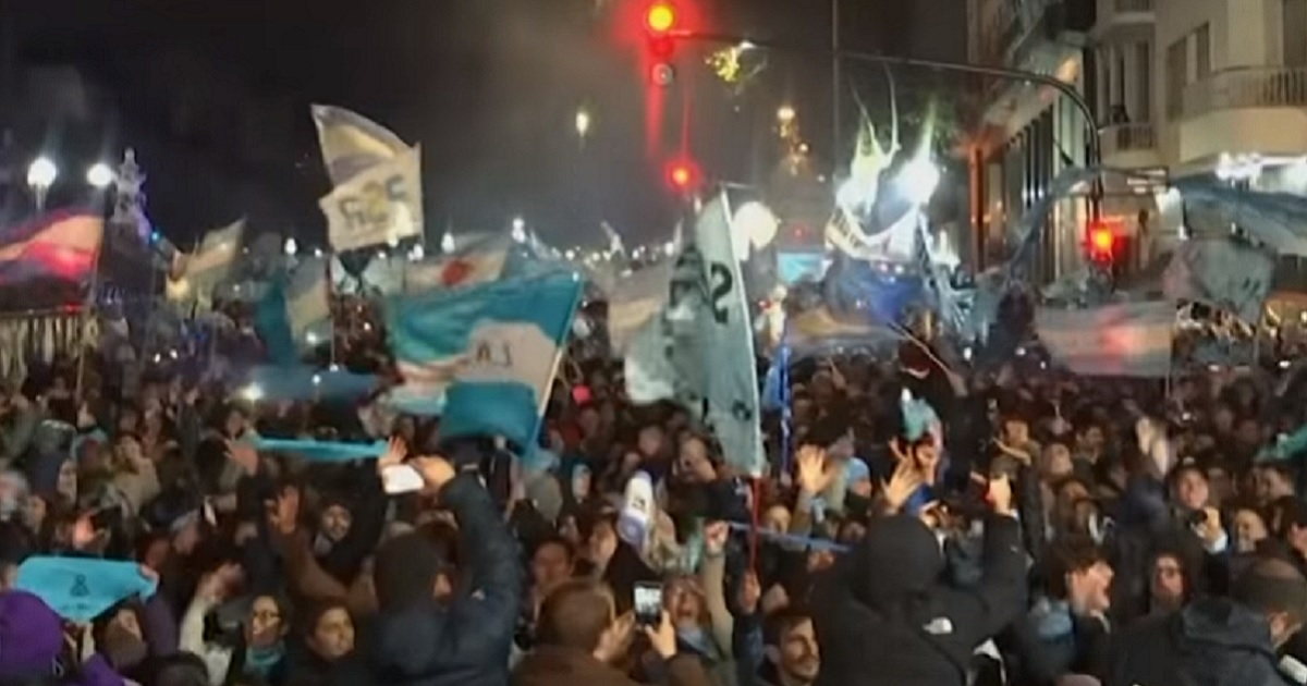 Crowd celebrating in the streets.