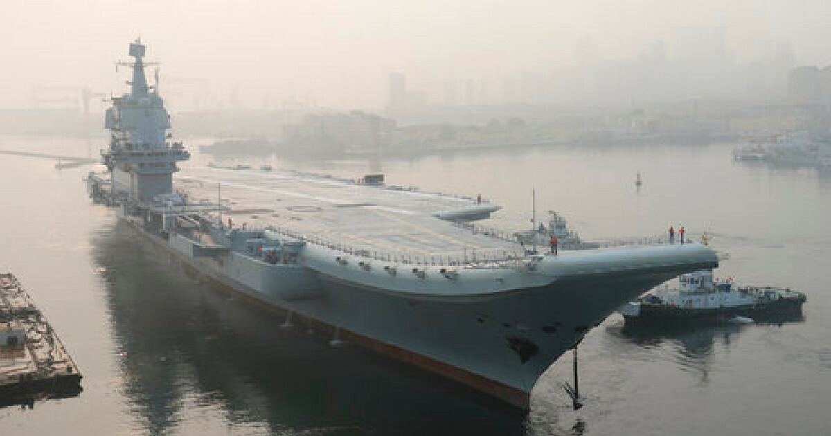 China's indigenous aircraft carrier lifts anchor in Dalian in northeast China's Liaoning Province