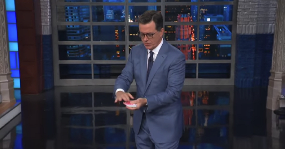 Shephen Colbert does a magic trick.