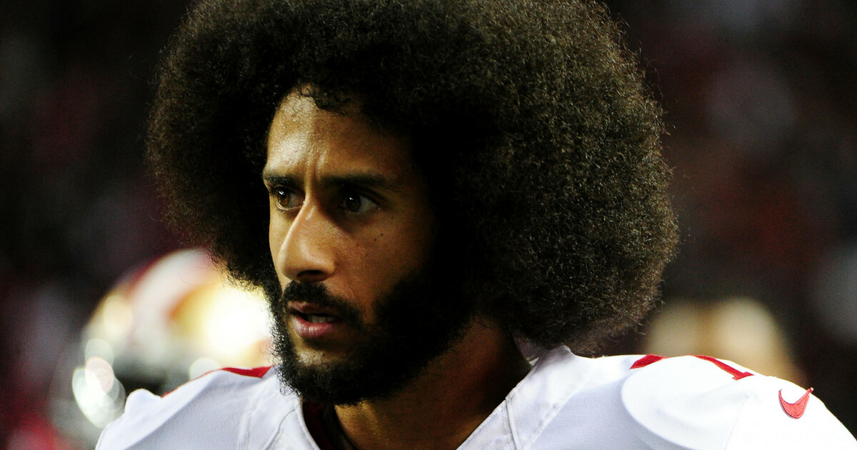 Colin Kaepernick #7 of the San Francisco 49ers looks on from the sidelines during the second half against the Atlanta Falcons at the Georgia Dome on December 18, 2016 in Atlanta, Georgia.