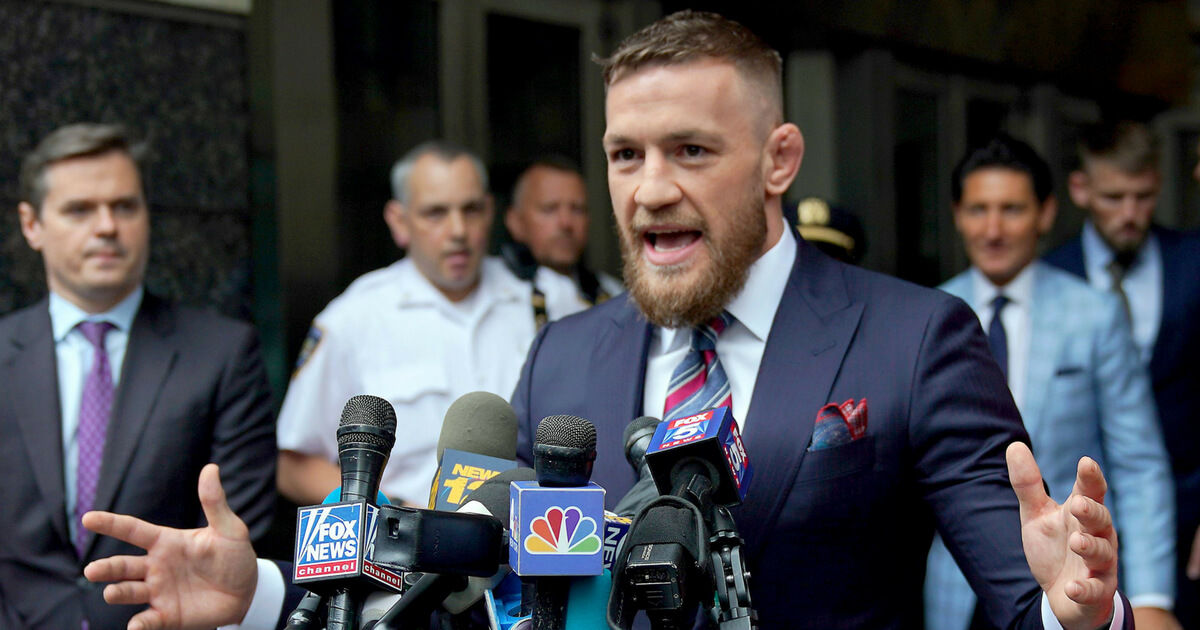 Irish mixed martial arts superstar Conor McGregor talks to the press after he pleaded guilty to a single violation of disorderly conduct, in Brooklyn Criminal Court on July 26, 2018.