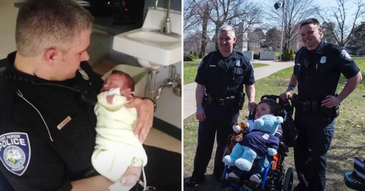 Police officers with the toddler they saved when he was just a newborn.