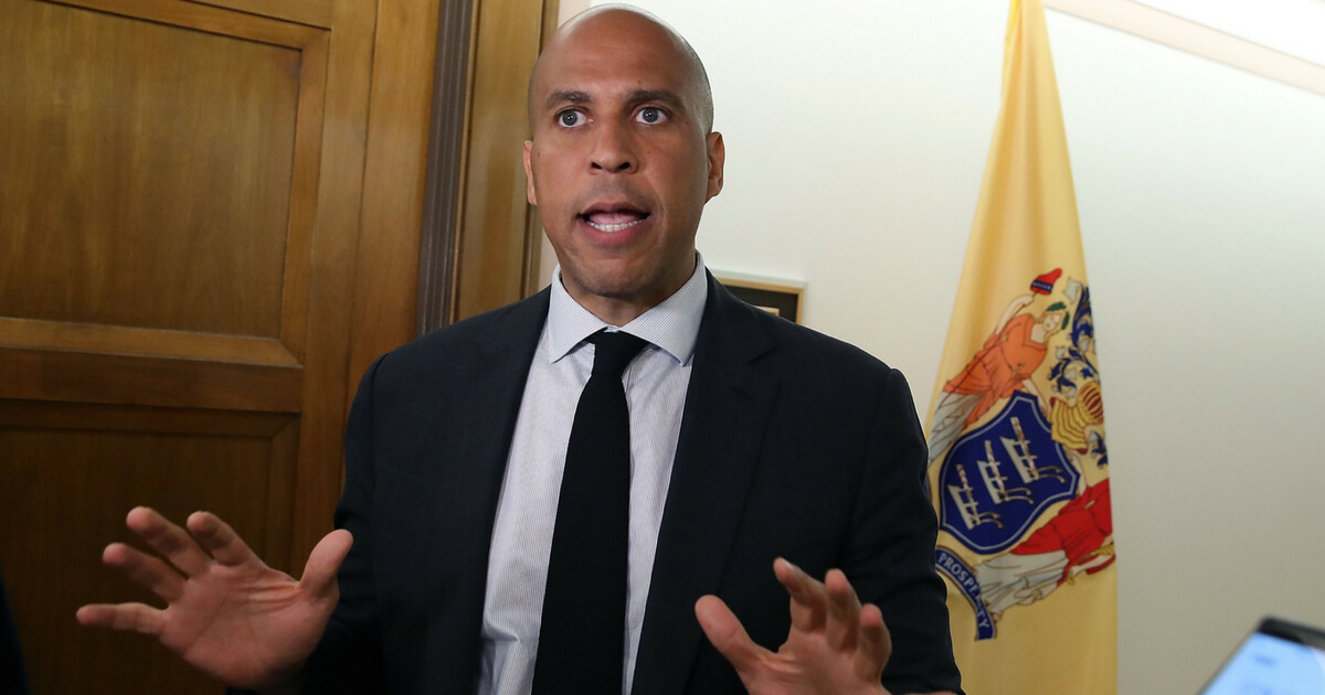 WASHINGTON, DC - JULY 18: U.S. Sen. Cory Booker (D-NJ) speaks to the media about a recently released video showing Supreme Court nominee Brett Kavanaugh saying he would 'put the final nail' in the Supreme Court precedent upholding the constitutionality of the independent counsel statute, outside of his office in the Dirksen Senate Office Building, on July 18, 2018 in Washington, DC.