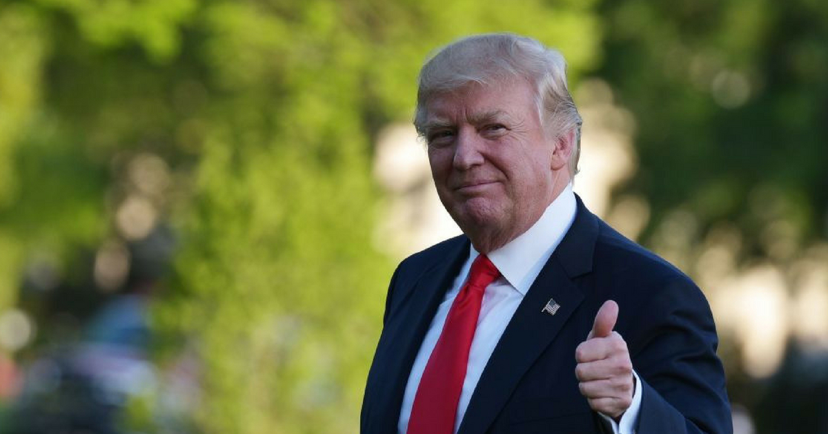 President Donald Trump gives a "thumbs up" signal