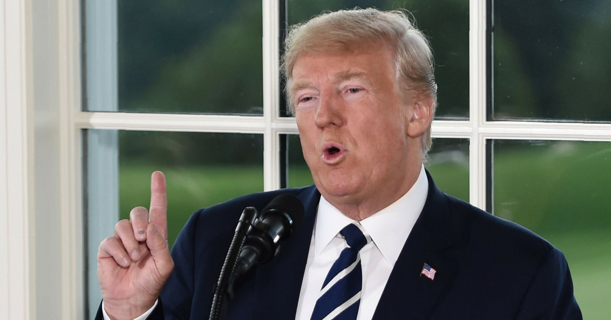 President Donald Trump gestures as he speaks during a dinner with business leaders in Bedminster, New Jersey, on Aug. 7.