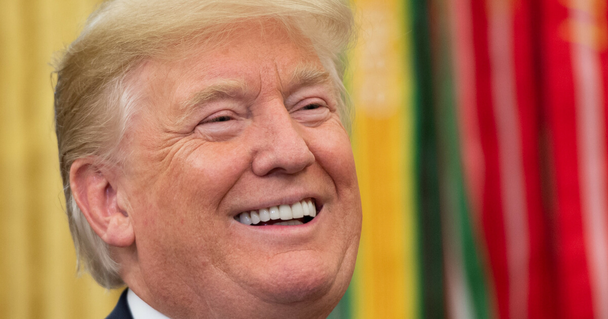 esident Donald Trump laughs in the Oval Office of the White House in Washington on July 30, 2018.