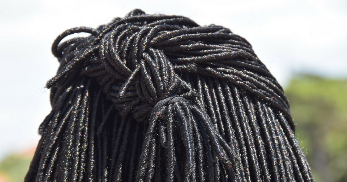 A young boy was asked to cut his hair at a Christian school in Florida because his dreads touched his shoulders.