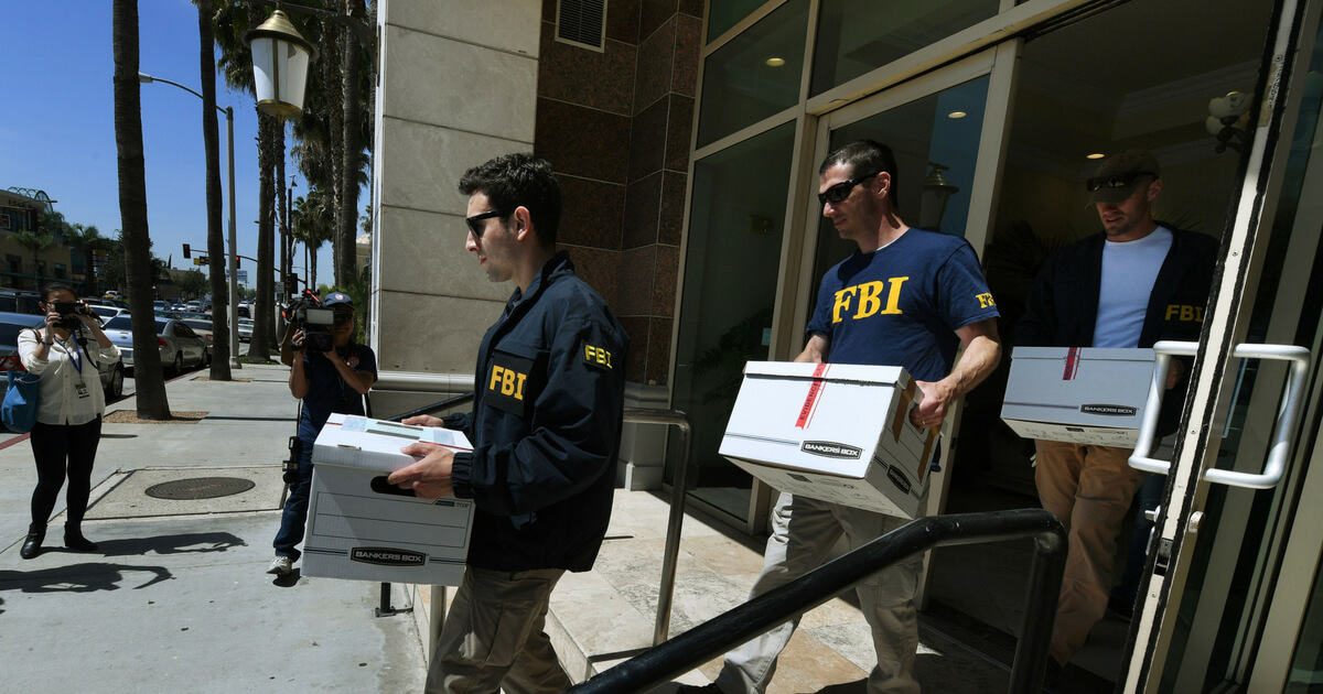 FBI agents remove boxes of documents from the offices of the California Investment Immigration Fund after serving search warrants in an investigation into an alleged USD 50 million high-end visa fraud scheme involving as many as 100 Chinese nationals in San Gabriel, California on April 5, 2017.
