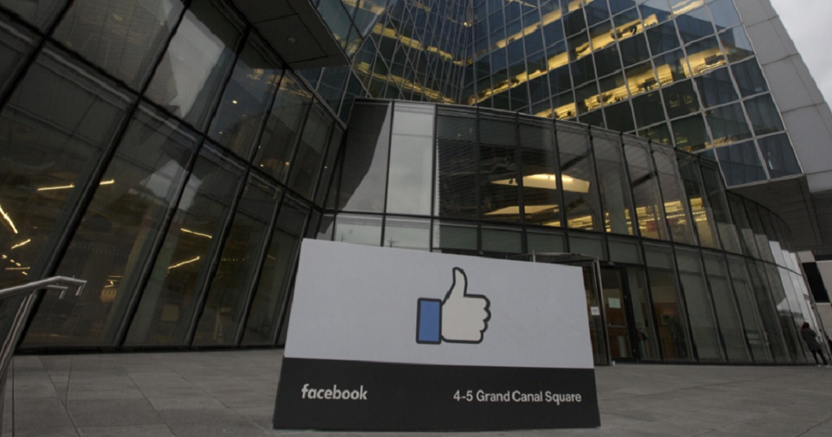 The Facbook "thumbs up" on a sign outside an office building.