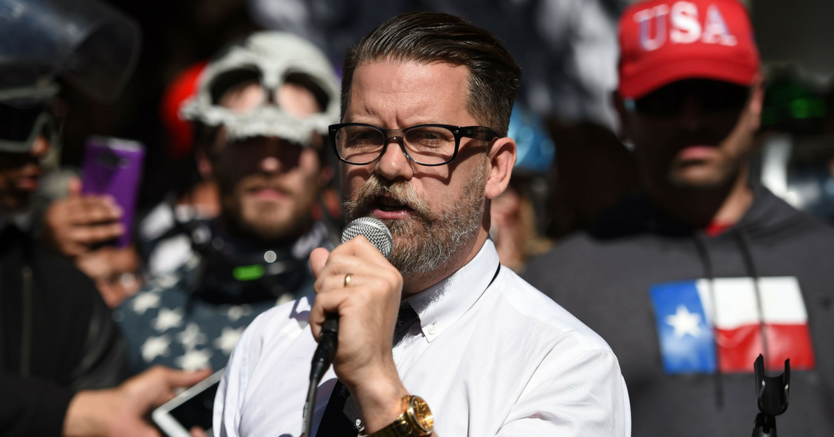 Vice Media co-founder and conservative speaker Gavin McInnes reads a speech written by Ann Coulter to a crowd during a conservative rally in Berkeley, California on April 27, 2017.
