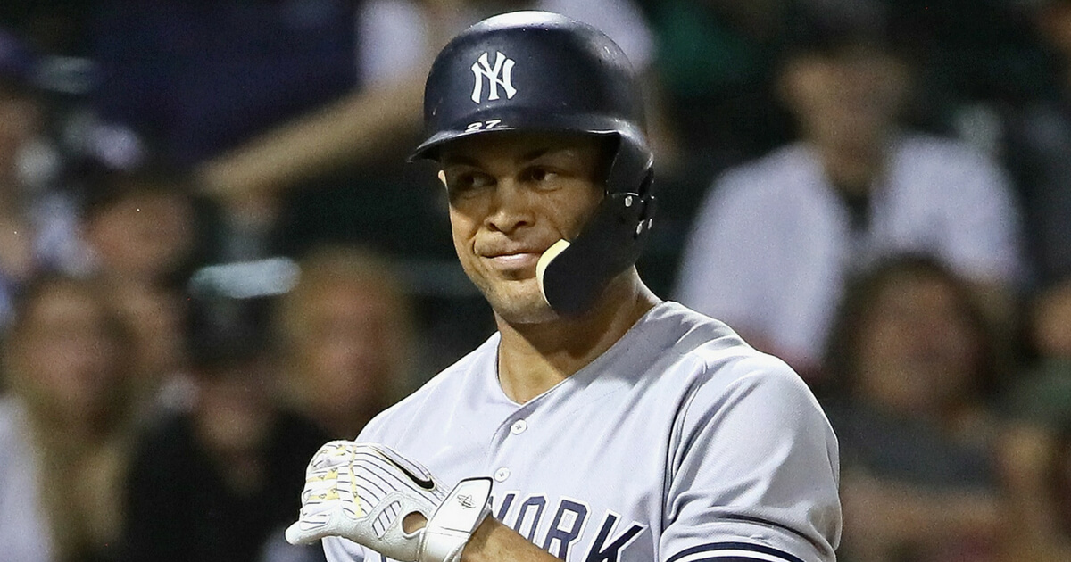 Giancarlo Stanton #27 of the New York Yankees reacts after striking out against Matt Davidson of the Chicago White Sox in the 9th inning at Guaranteed Rate Field on Aug. 6, 2018, in Chicago.
