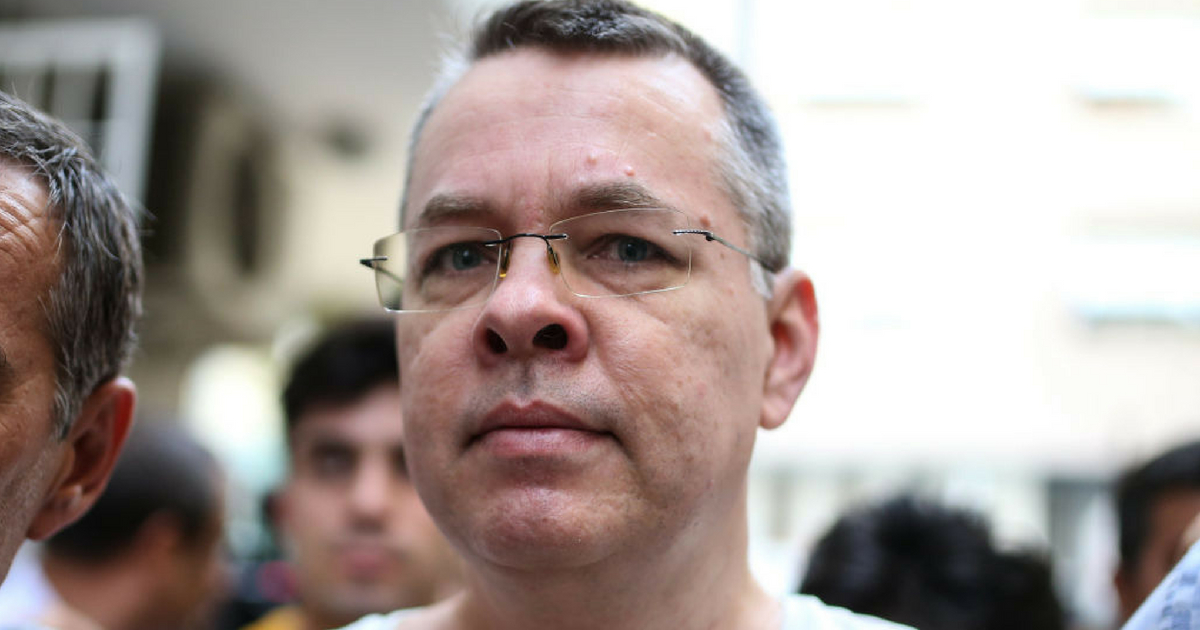 US pastor Andrew Craig Brunson escorted by Turkish plain clothes police officers arrives at his house on July 25, 2018 in Izmir.