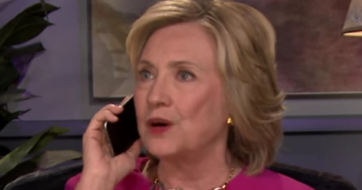 Hillary Clinton speaks on her phone
