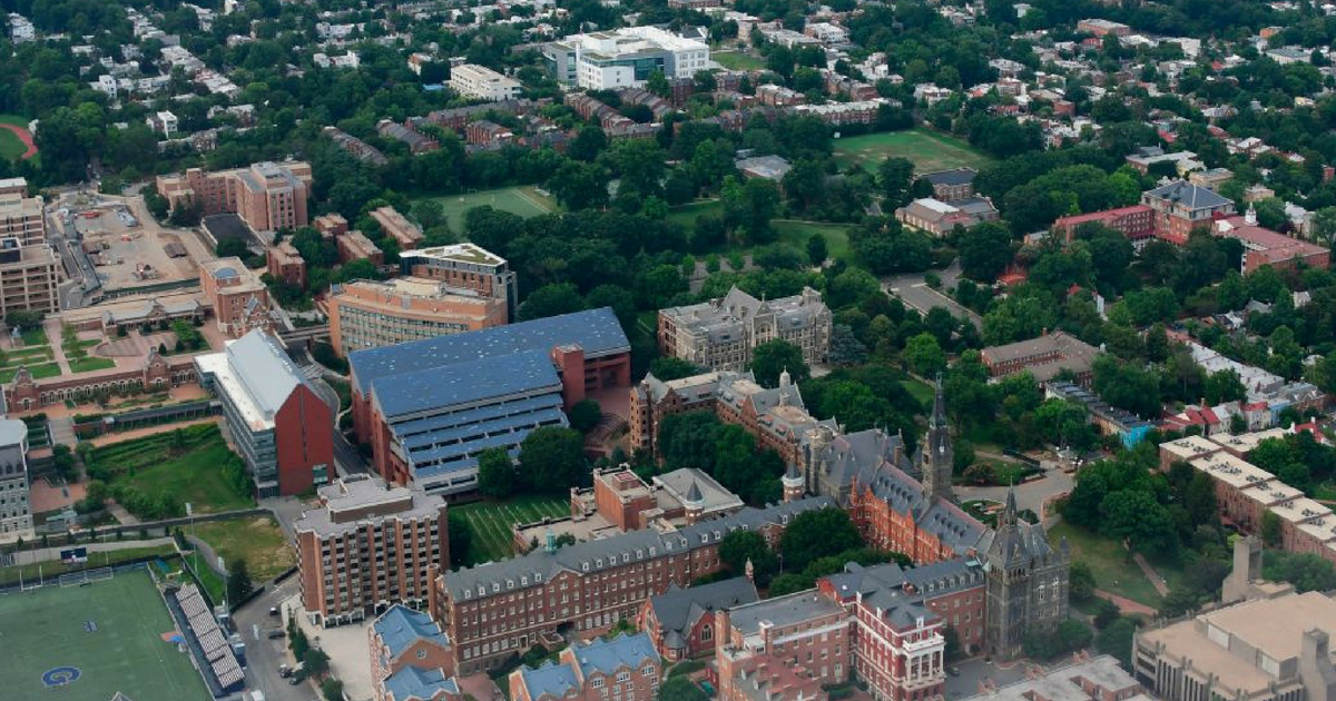 Aerial view of the Georgetown University complex (foreground) and the Georgetown neighborhood in Washington, DC on Independence Day July 4,2018.