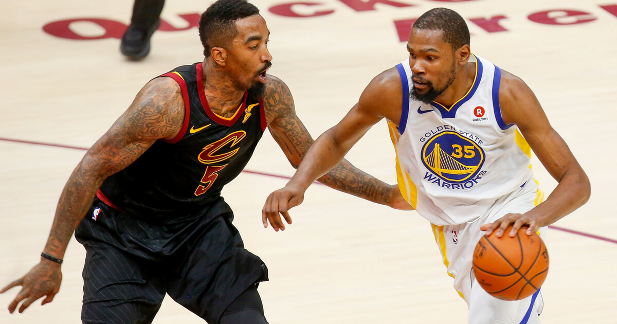 J.R. Smith of the Cleveland Cavaliers defends against Kevin Durant of the Golden State Warriors during Game 4 of the 2018 NBA Finals at Quicken Loans Arena in Cleveland on June 8, 2018.