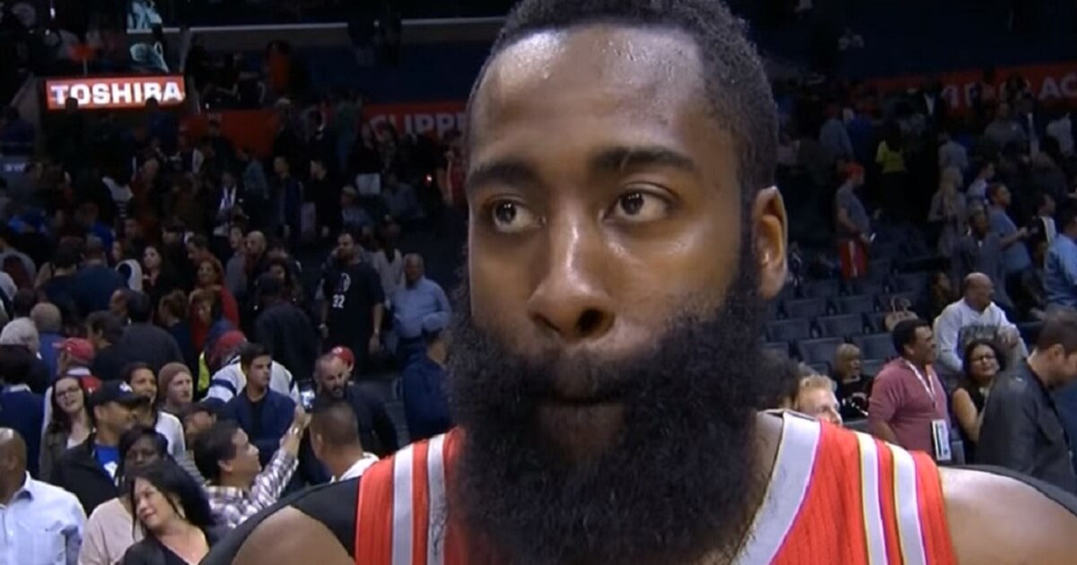 James Harden being interviewed on court during a game.