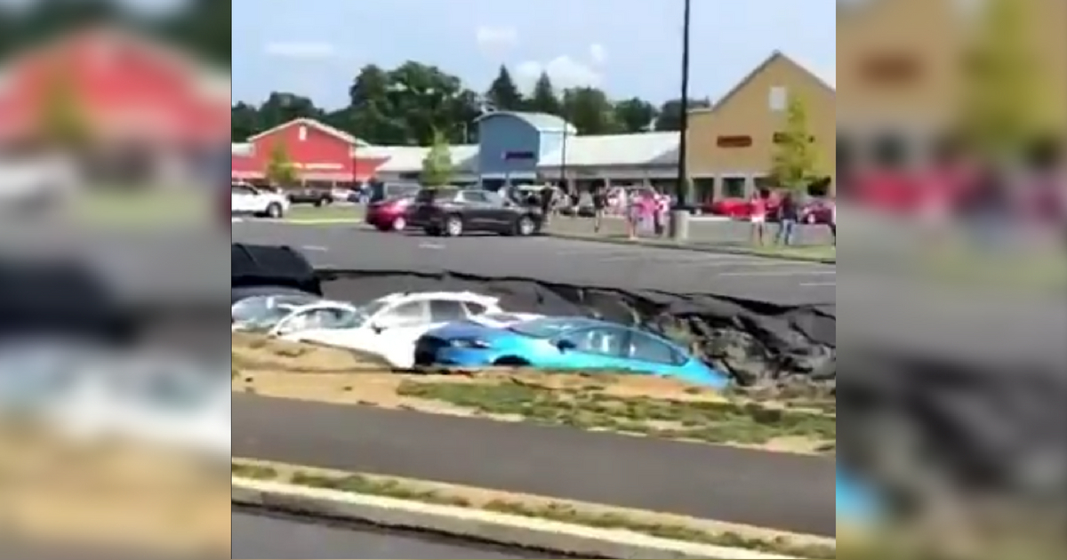 A sinkhole caused part of the parking lot at Tanger Outlets in Lancaster County, Pennsylvania, to collapse, taking six cars with it.