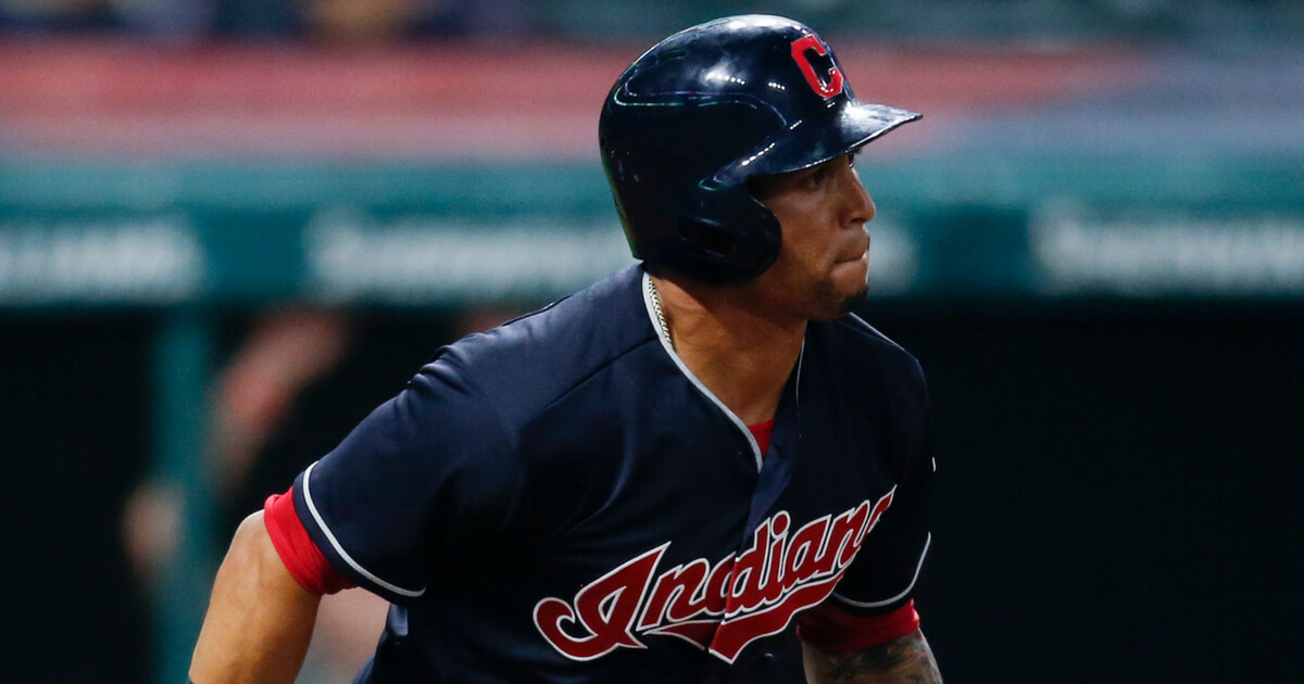 Leonys Martin #13 of the Cleveland Indians hits a sacrafice fly off Trevor Hildenberger #39 of the Minnesota Twins during the eighth inning at Progressive Field on August 7, 2018 in Cleveland.