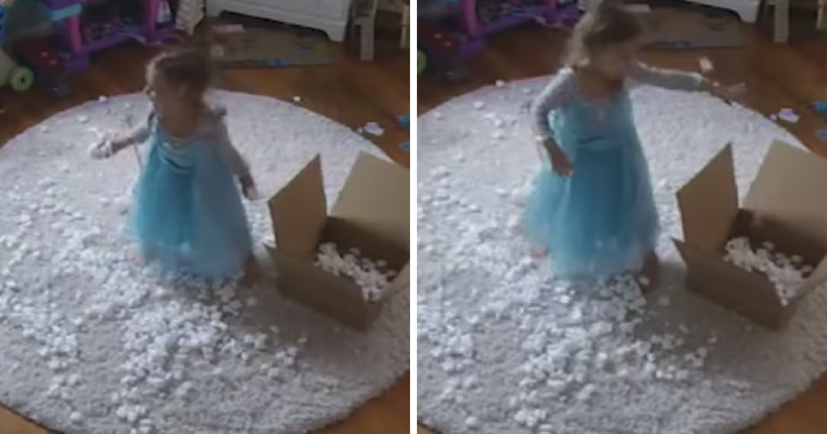 A little girl dressed up as Elsa throws packing peanuts as she sings 'Let it Go.'