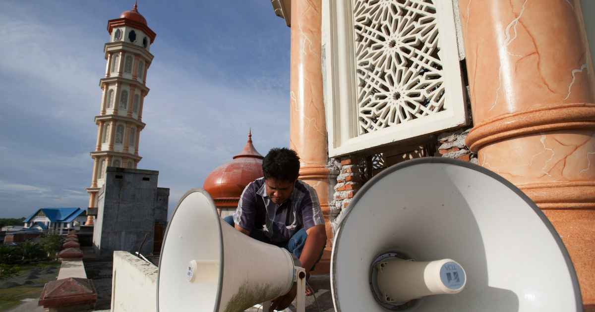 An Acehnese worker inspects a loudspeaker at a mosque on the eve of the Islamic holy month Ramadan in Meulaboh town in Indonesia's Aceh province on June 28, 2014.