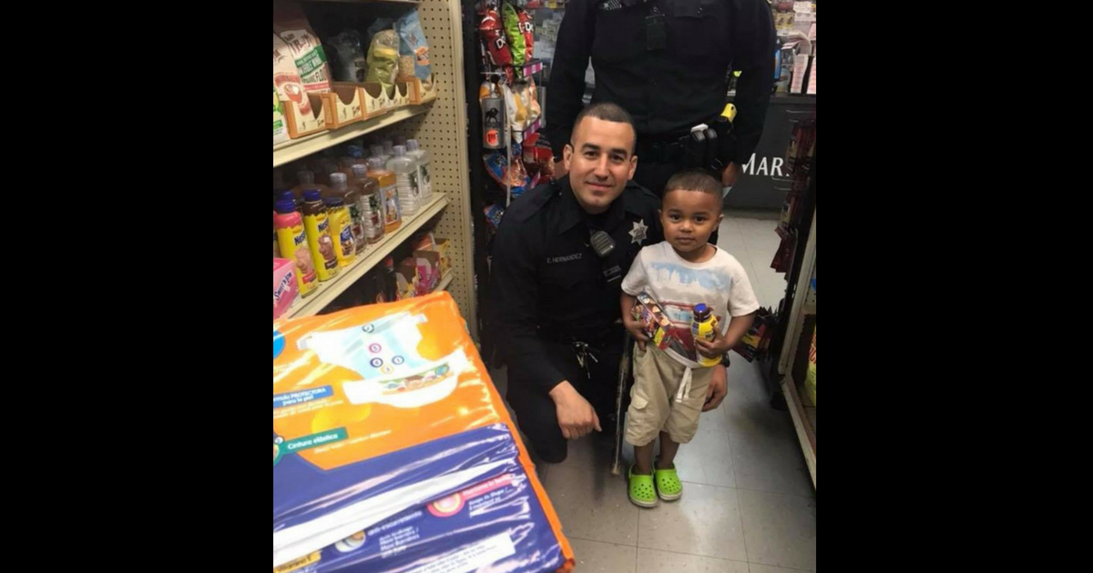Two police officers offer to take a mother and her son to the store to get food, milk and diapers.