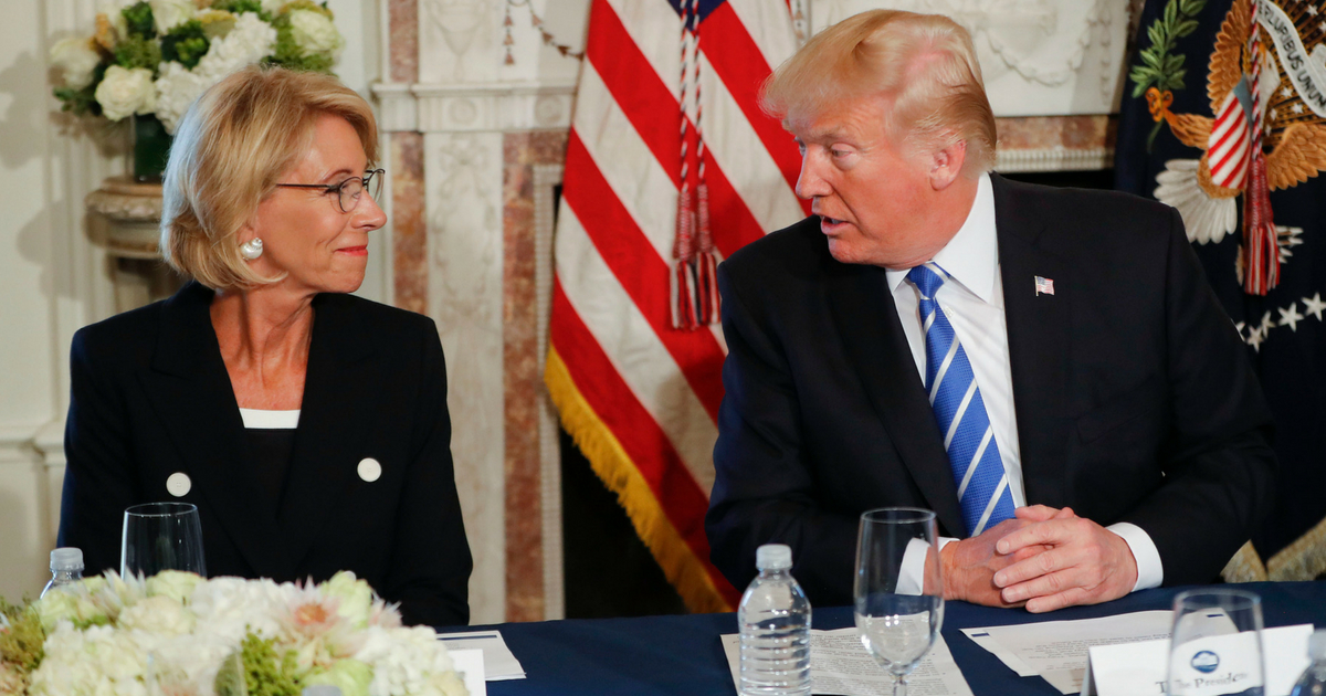 President Donald Trump looks toward Education Secretary Betsy DeVos, as he speaks during a workforce/apprenticeship discussion at Trump National Golf Club in Bedminster, N.J., Friday, Aug. 11, 2017.