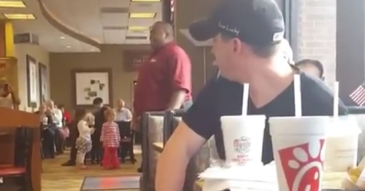 A Chick-fil-A employee stood up and sang "Proud to be an American" in his restaurant for all to hear.