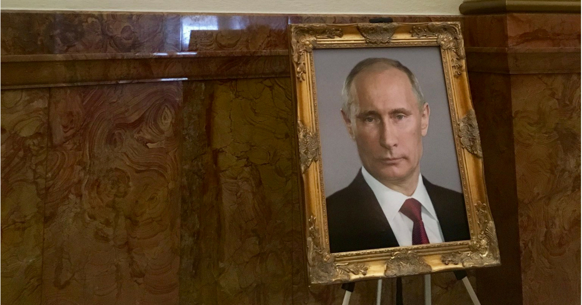 An adviser to a Democratic legislative leader helped a liberal group put a picture of Russian President Vladimir Putin on brief display at the Colorado state capitol building near a spot reserved for a portrait of President Donald Trump.