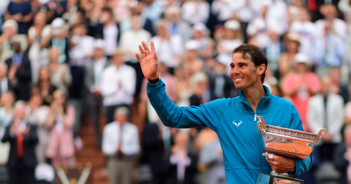 Rafael Nadal of Spain celebrates with the trophy after beating Dominic Thiem of Austria 6-4 6-3 6-2 in the final of the men's singles at Roland Garros during the French Open on June 10, 2018, in Paris, France.