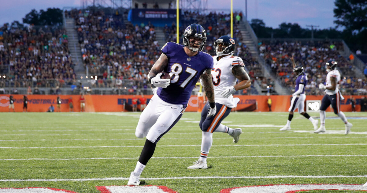 Maxx Williams #87 of the Baltimore Ravens runs into the end zone with a five-yard touchdown reception in the first quarter of the Hall of Fame Game against the Chicago Bears at Tom Benson Hall of Fame Stadium on August 2, 2018 in Canton, Ohio.