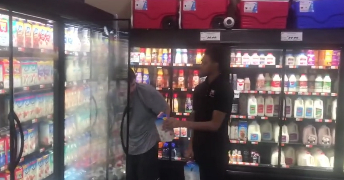 Rouse employee lets a boy with autism stack shelves