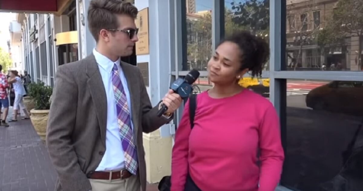 Man interviewing woman on street