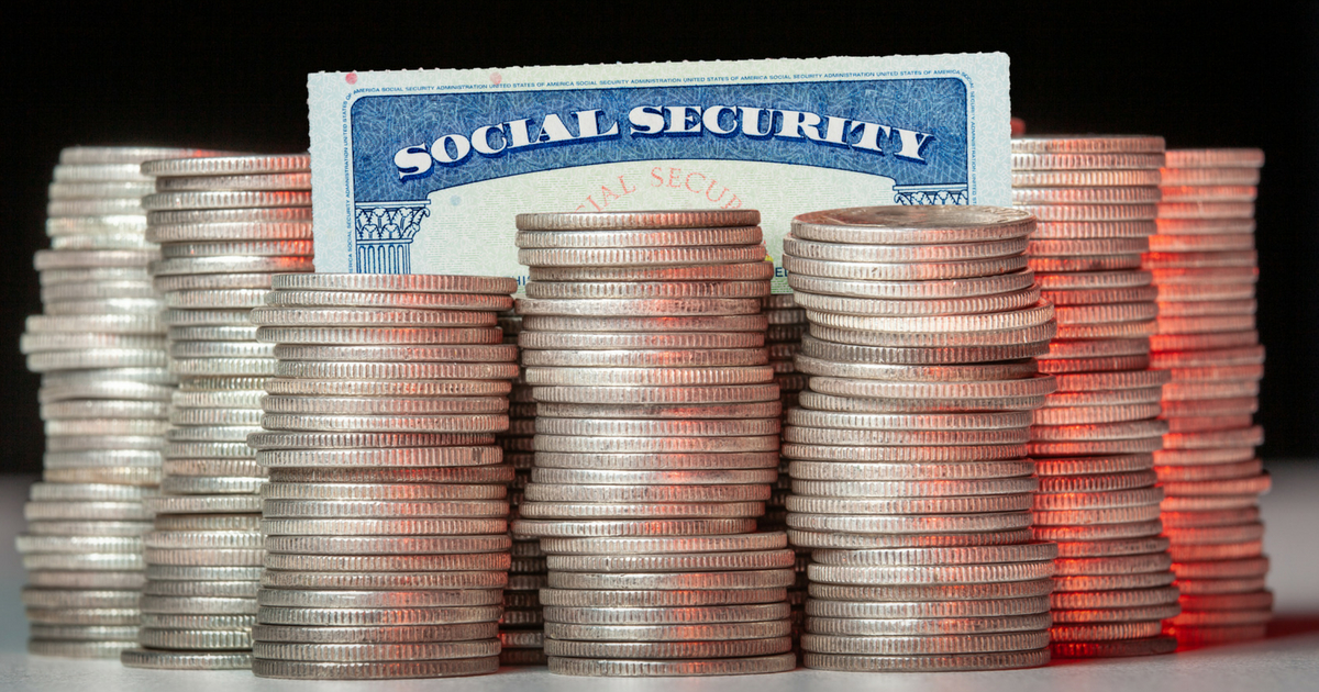 Many stacks of old silver dimes with social security card.