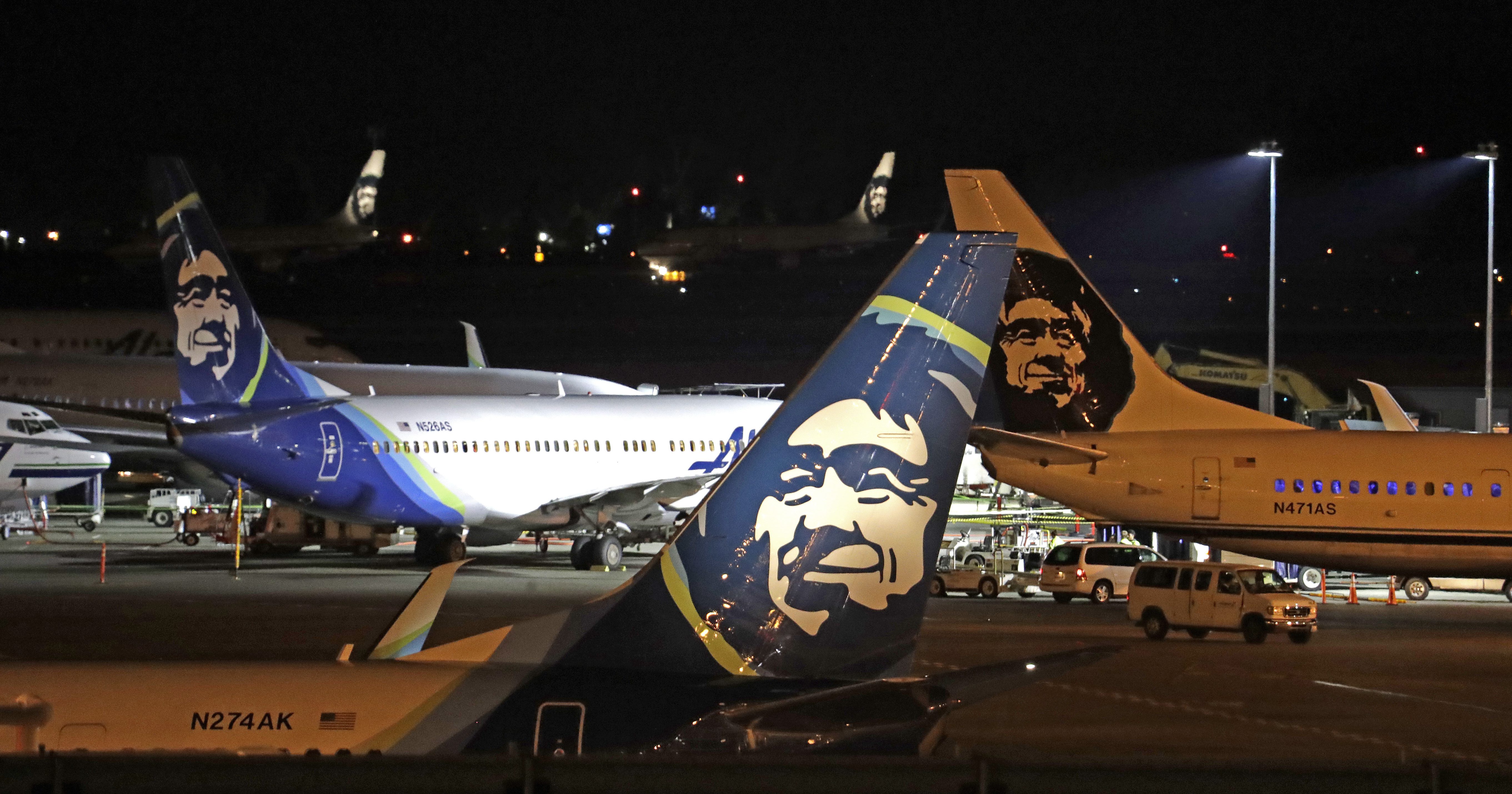 Alaska Airlines planes sit on the tarmac at Sea-Tac International Airport Friday evening, Aug. 10, 2018, in SeaTac, Wash.