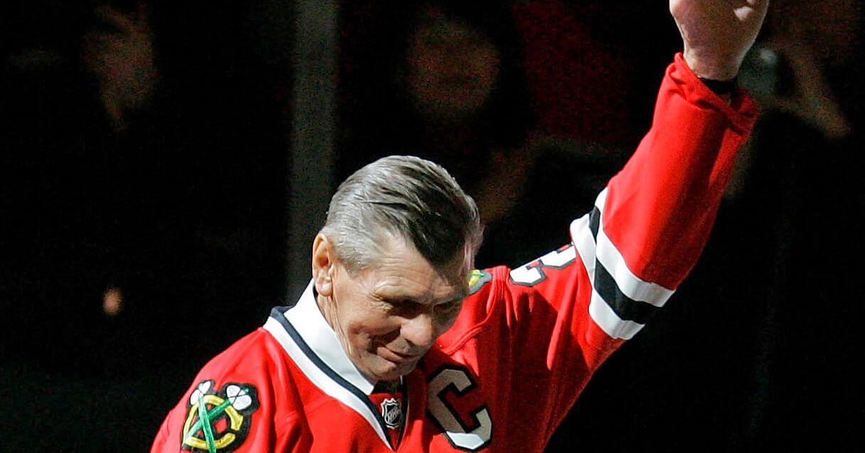 In this March 7, 2008, file photo, Chicago Blackhawks great Stan Mikita waves to fans as they as he is introduced before an NHL hockey game against the San Jose Sharks in Chicago. Mikita, who played for the Blackhawks for 22 seasons, becoming one of the franchise's most revered figures, has died, the Blackhawks announced Tuesday, Aug. 7, 2018. He was 78.