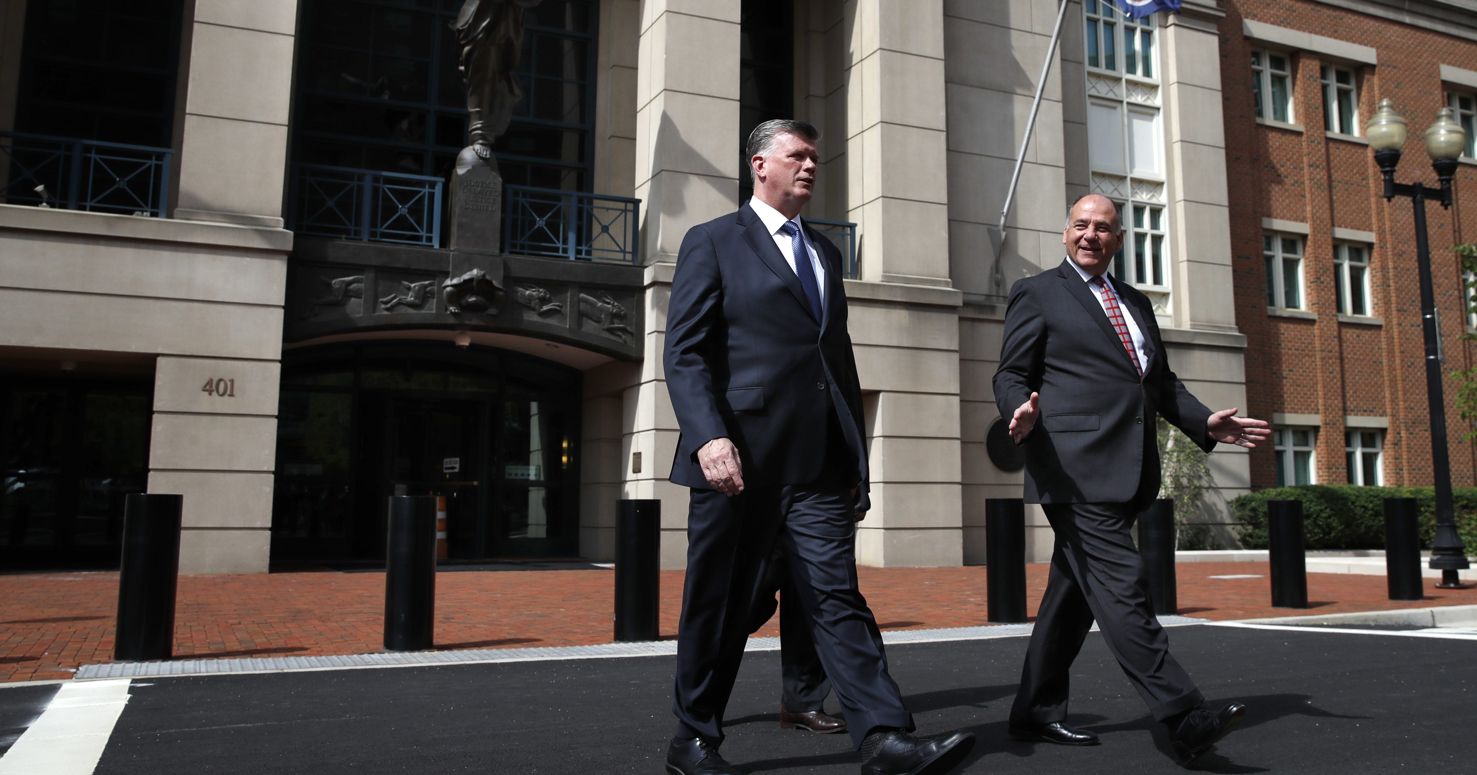 Kevin Downing, left, and Thomas Zehnle, with the defense team for Paul Manafort, leave federal court during the second day of jury deliberations in the trial of the former Trump campaign chairman, in Alexandria, Virginia, Friday.