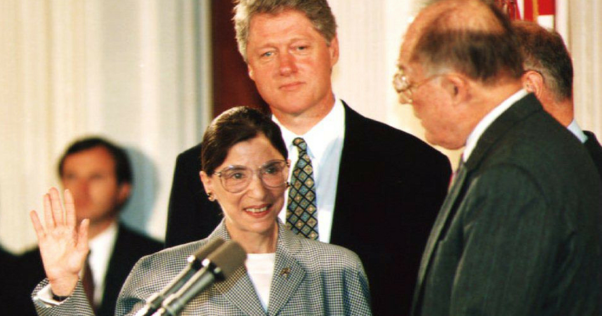 Newly-appointed U.S. Supreme Court Justice Ruth Bader Ginsburg as U.S. President Bill Clinton looks on