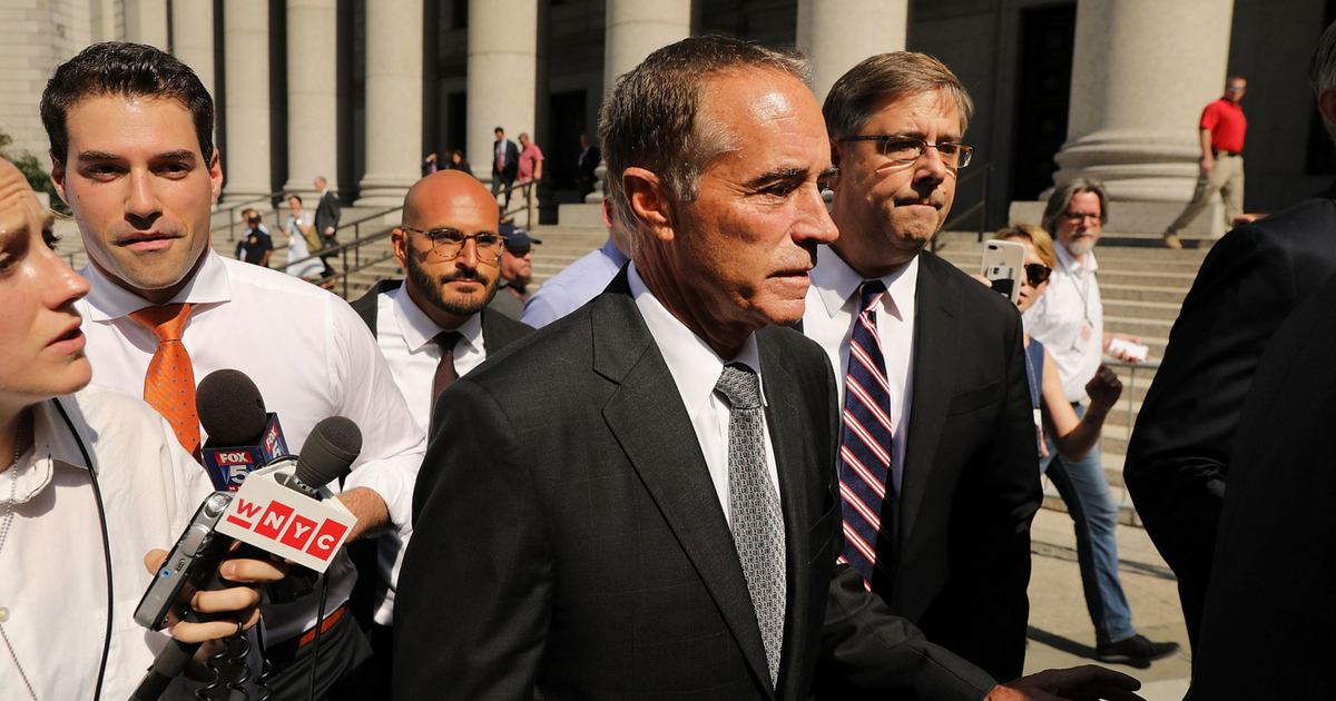 Rep. Chris Collins (R-NY) walks out of a New York court house after being charged with insider trading