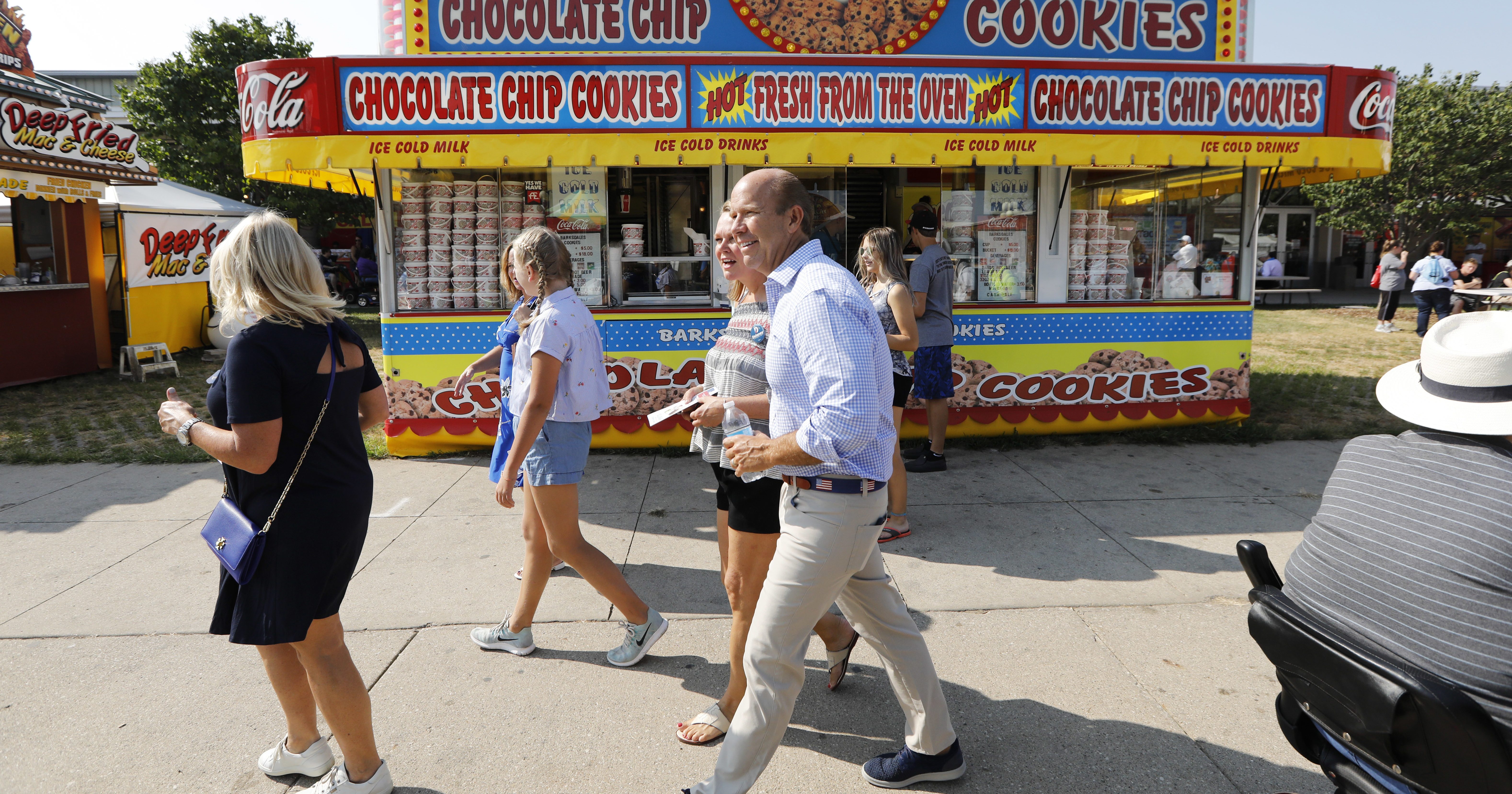 Rep. John Delaney, D-Md., walks past a concession stand during a visit to the Iowa State Fair, Friday, Aug. 10, 2018, in Des Moines, Iowa.
