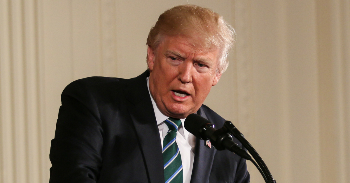 President Donald Trump speaking at podium