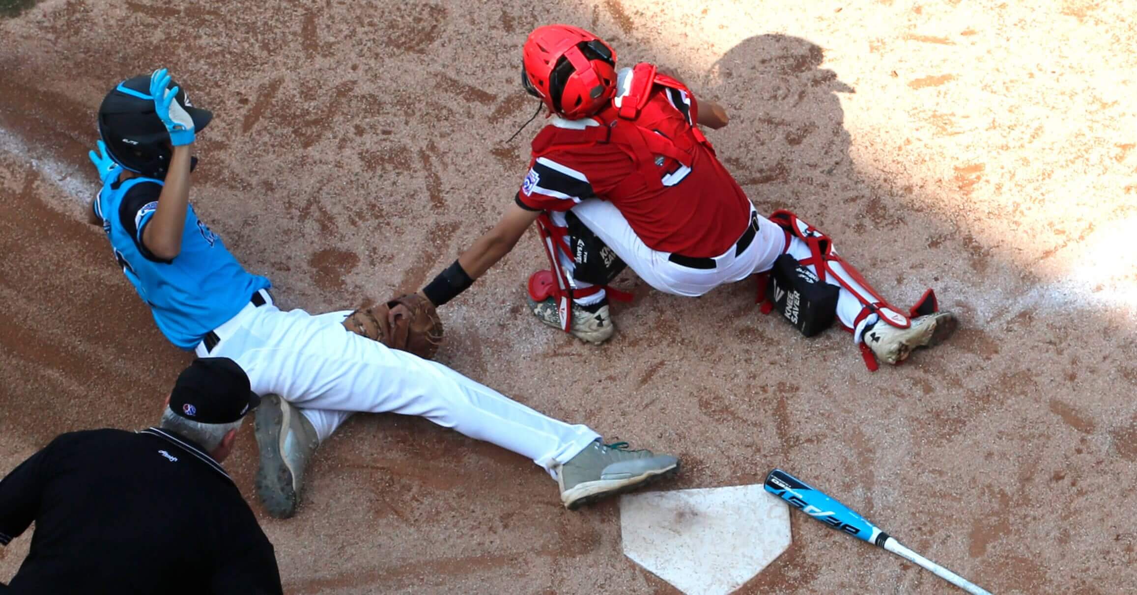Canada catcher Andre Juco tags out Puerto Rico's Carlos De Jesus (17) at home during the fourth inning of Little League World Series baseball tournament game in South Williamsport, Pa., on Wednesday.
