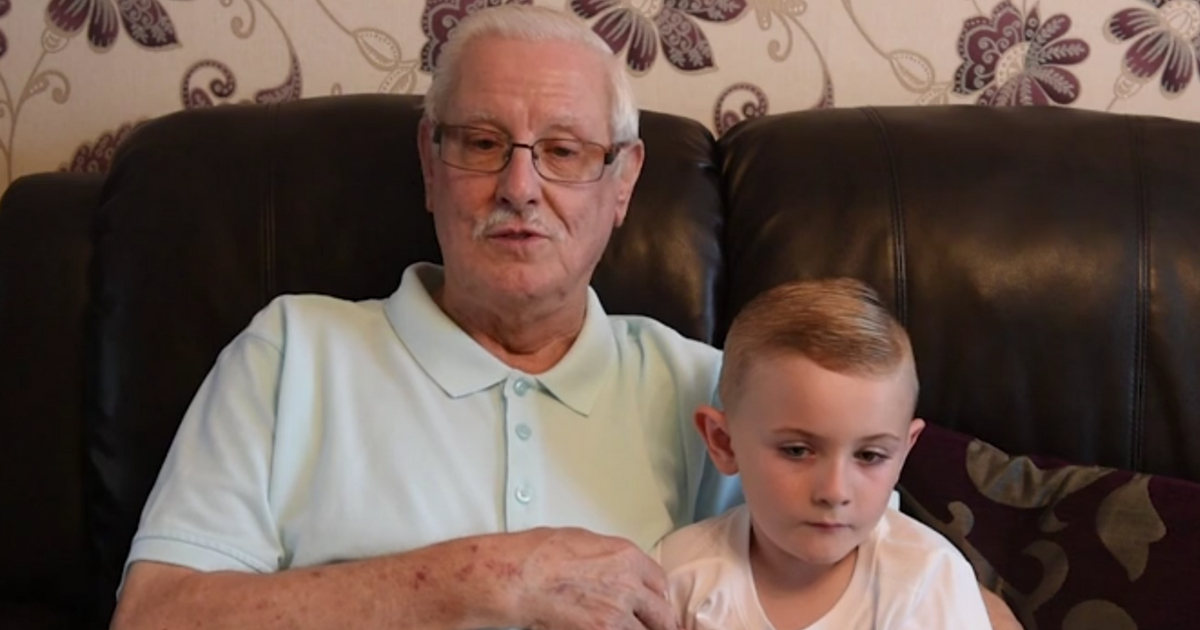 A great-grandfather sits with his great-grandson who saved his life