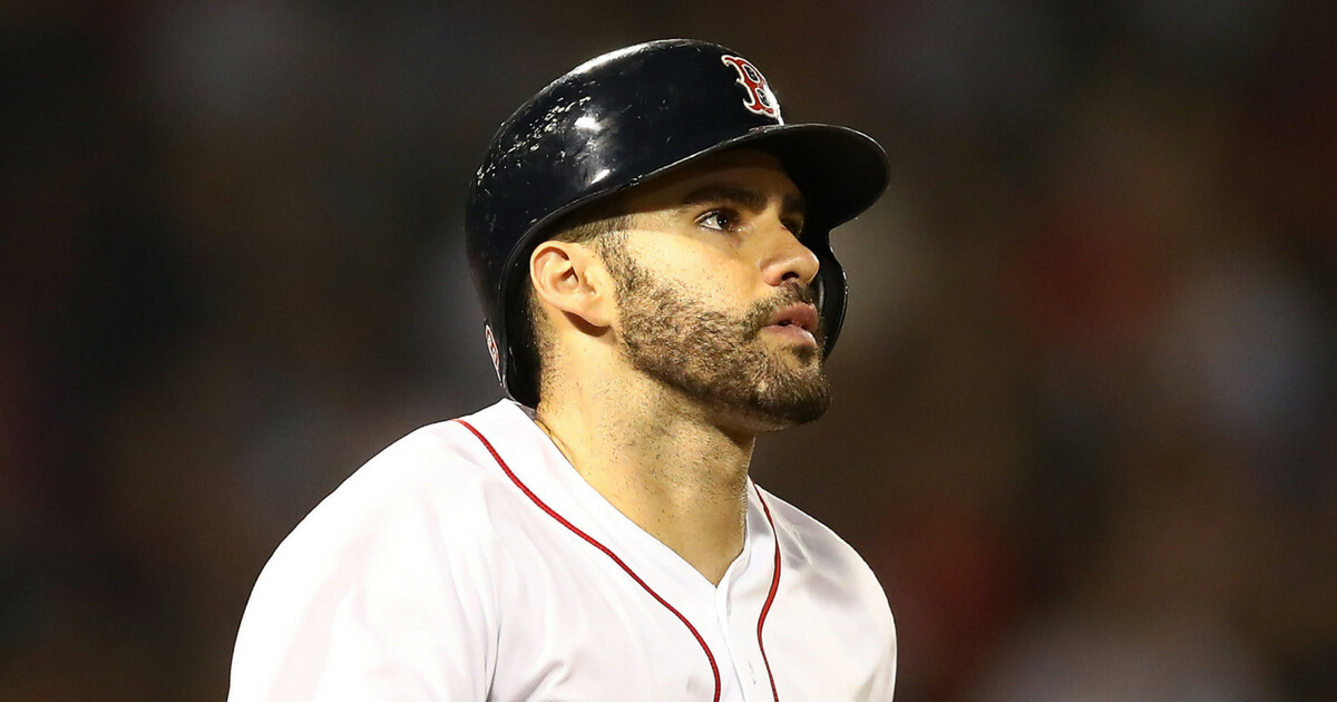 J.D. Martinez of the Boston Red Sox points upward in the eighth inning of a game against the Cleveland Indians at Fenway Park